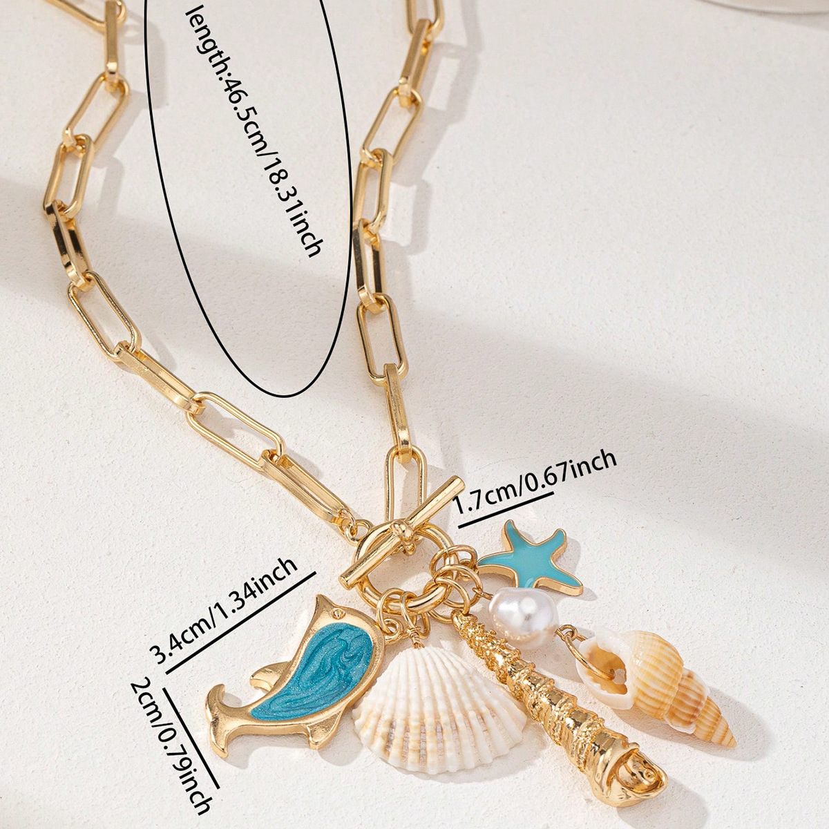 Gold Tone Paperclip Chain Toggle Necklace with Ocean Charms Dolphin Starfish view 3